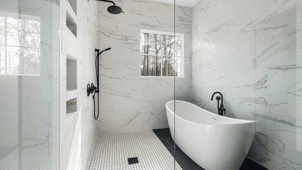Modern waterproofed and tiled bathroom with a freestanding bath